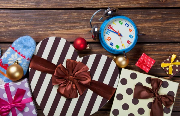 Alarm clock and christmas gifts — Stock Photo, Image