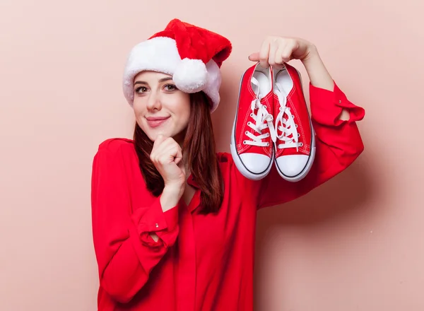 Woman with gumshoes — Stock Photo, Image