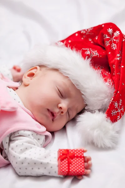 Little baby sleeping with christmas gift — Stock Photo, Image