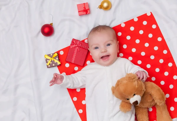 Little baby with christmas gifts — Stock Photo, Image