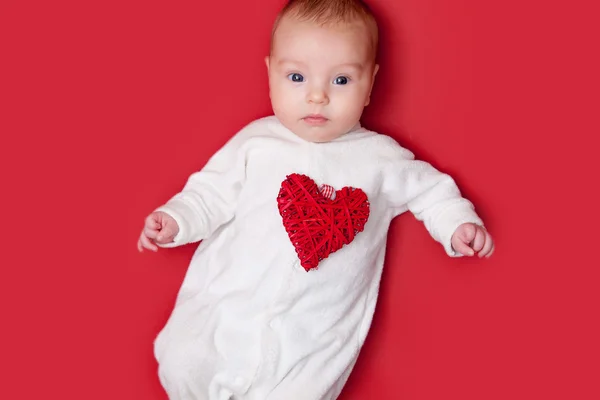 Baby on red background — Stock Photo, Image