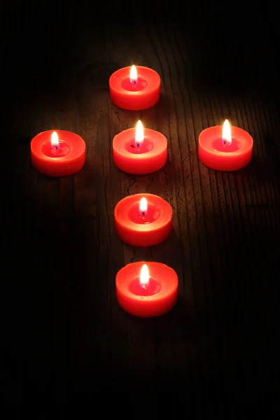 Candles  in a cross — Stock Photo, Image