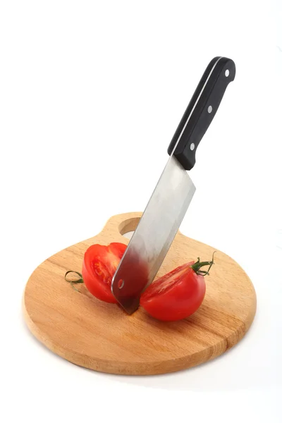 Cleaver and tomato — Stock Photo, Image