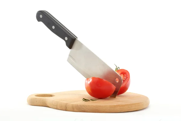 Cleaver and tomato — Stock Photo, Image