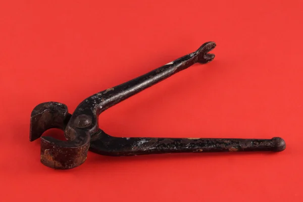 Close up photo of Pliers on a red  background — Stock Photo, Image