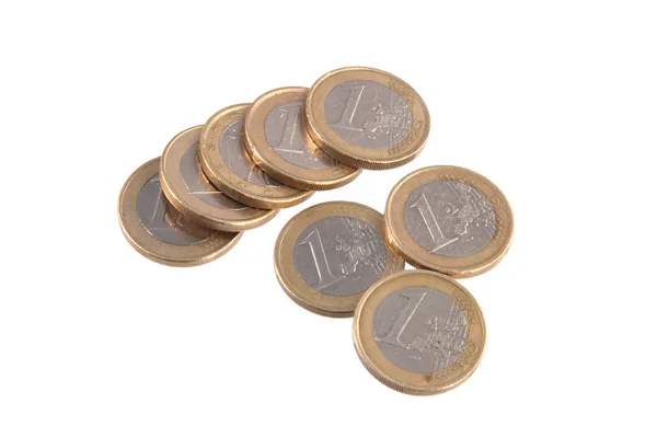 Monedas de euros sobre un fondo blanco liso . — Foto de Stock