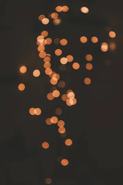 Hermoso Fondo Naranja Festivo Efecto Bokeh Luz Sobre Fondo Oscuro —  Fotos de Stock