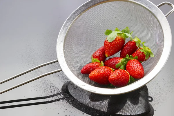 Strawberries in strainer — Stock Photo, Image