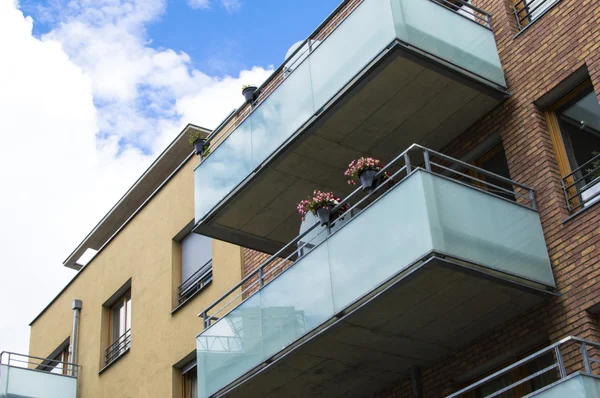 Modern house with beautiful glass balconies — Stock Photo, Image