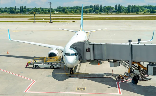 Preparation of a passenger plane for departure from the airport - refueling, maintenance, baggage loading.