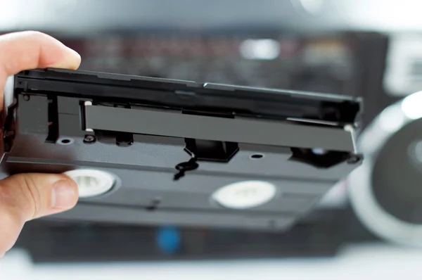 Plastic, black videotape in hand — Stock Photo, Image