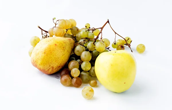 Pear, apple and branch of ripe grapes — Stock Photo, Image