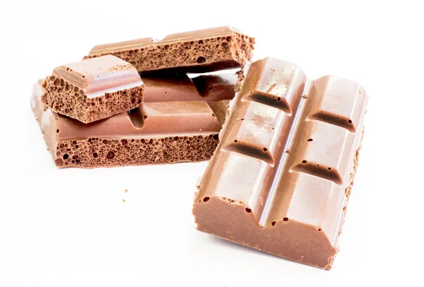 Pieces of tile porous milk chocolate — Stock Photo, Image