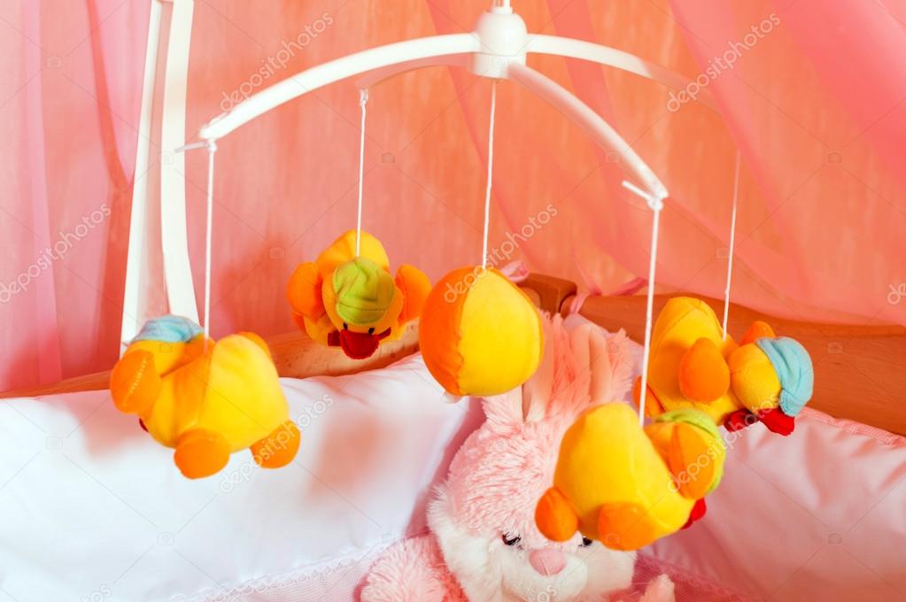 Musical roundabout with soft toys, mobile Stock Photo by ©gorvik 57113185