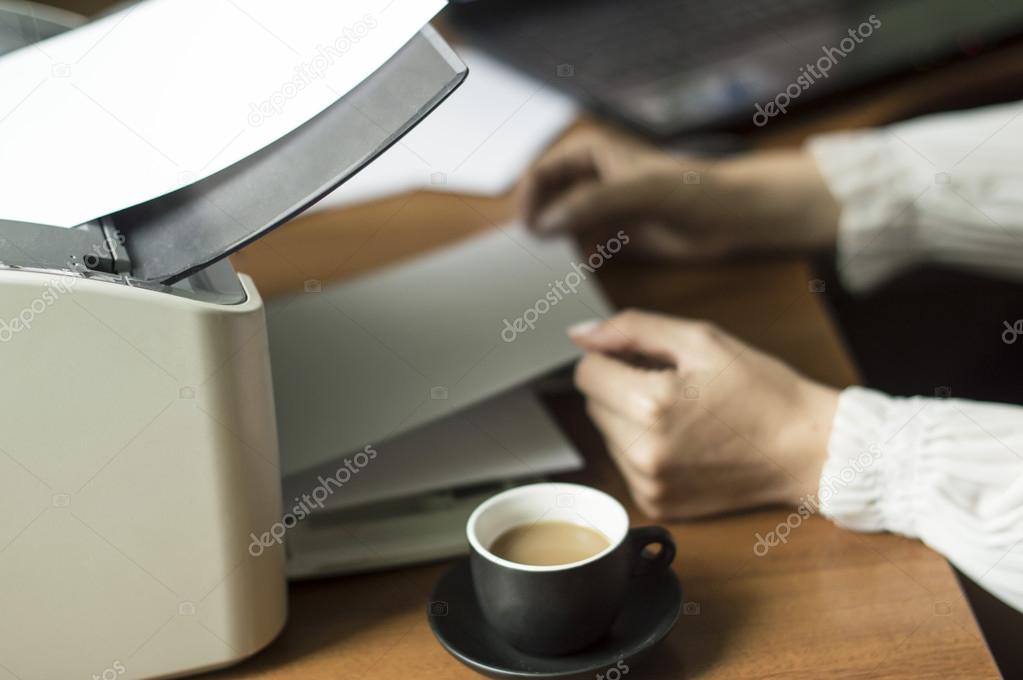 The process of inserting paper in laser printer Stock Photo by ©gorvik