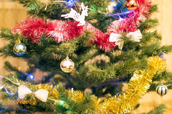 Christmas tree with different toys, decorations and garlands — Stock Photo, Image