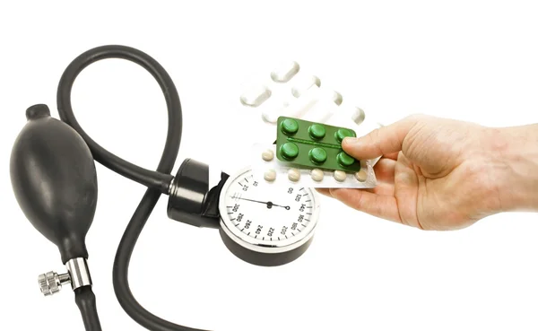 Apparatus for measuring blood pressure and different pills in ha — Stock Photo, Image
