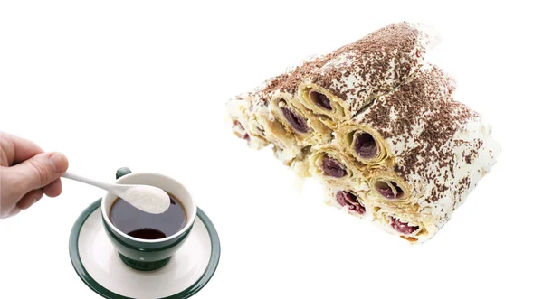 Black tea with a cake on a white background — Stock Photo, Image