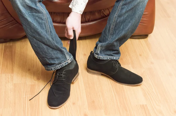 The process of wear black suede shoes — Stock Photo, Image