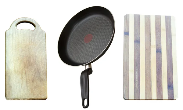 Frying pan and two wooden boards for products — Stock Photo, Image