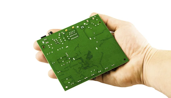 Electronic microcircuit in his hand — Stock Photo, Image