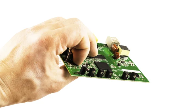 Elektronische microcircuit in zijn hand — Stockfoto