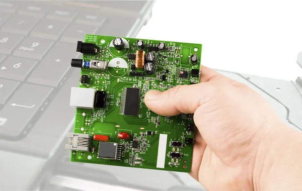 Electronic microcircuit in hand — Stock Photo, Image