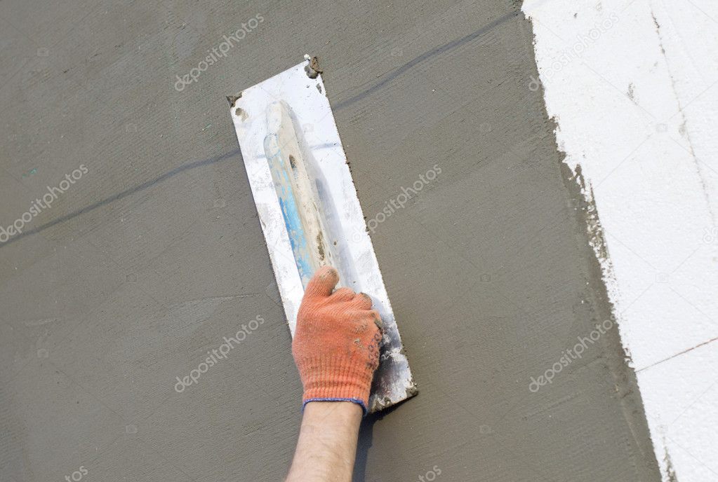 The process of applying putty to the  polyfoam wall 