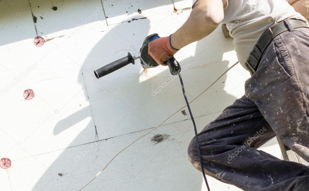 The process of drilling holes in the white polyfoam 