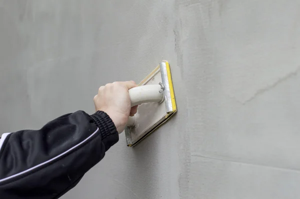 Smoothing of the plastered wall — Stock Photo, Image