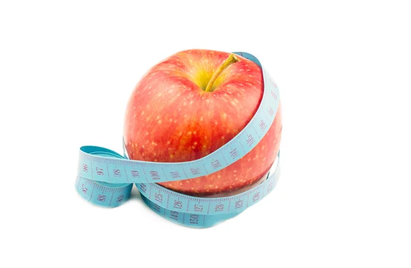 Red apple wrapped in measuring tape — Stock Photo, Image