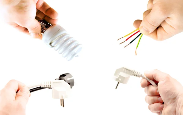 Wires, plugs and lamp in hand — Stock Photo, Image