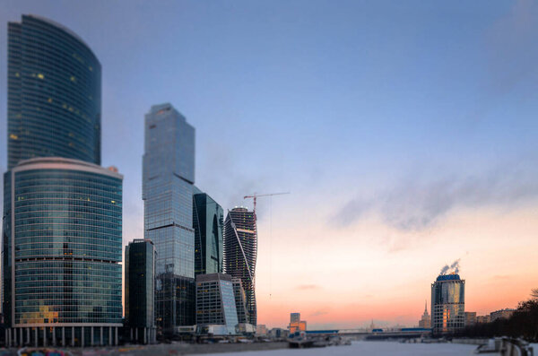 Evening view of the Moscow river  Krasnopresnenskaya embankment and Moscow-city business center.