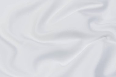 Beyaz kumaş arka planının soyut ve yumuşak odak dalgası, beyaz doku ve detay