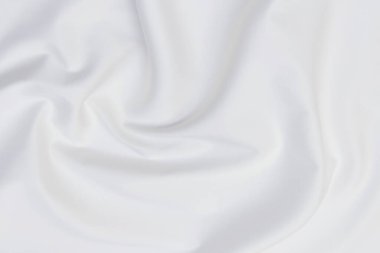 Beyaz kumaş arka planının soyut ve yumuşak odak dalgası, beyaz doku ve detay