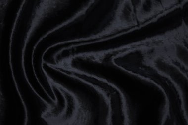 Kadife ipek, pamuk ya da yün kumaş dokusu. Koyu gri ya da siyah renk. Doku, arkaplan, desen.
