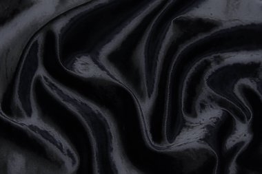Kadife ipek, pamuk ya da yün kumaş dokusu. Koyu gri ya da siyah renk. Doku, arkaplan, desen.