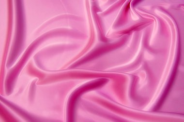 Doğal kırmızı ya da pembe kumaş ya da kumaşın yakın çekim dokusu aynı renkte. Doğal pamuk, ipek, yün veya keten kumaş dokusu. Kırmızı tuval arkaplanı.