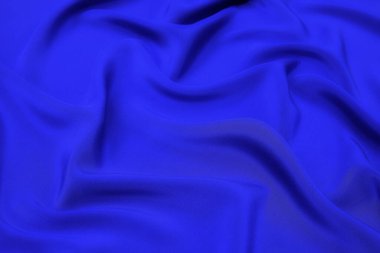 Mavi kumaş dokusu arka plan, dalgalı kumaş yumuşak mavi renk, lüks saten veya ipek kumaş dokusu.