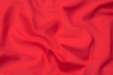 Doğal kırmızı ya da pembe kumaş ya da kumaşın yakın çekim dokusu aynı renkte. Doğal pamuk, ipek, yün veya keten kumaş dokusu. Kırmızı ve pembe tuval arkaplan.