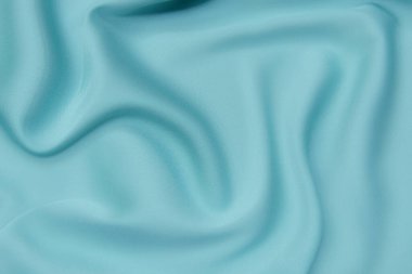 Doku, arka plan, desen. Yeşil doku ya da ipek kumaş. Güzel yeşil ya da sakin yumuşak ipek kumaş.