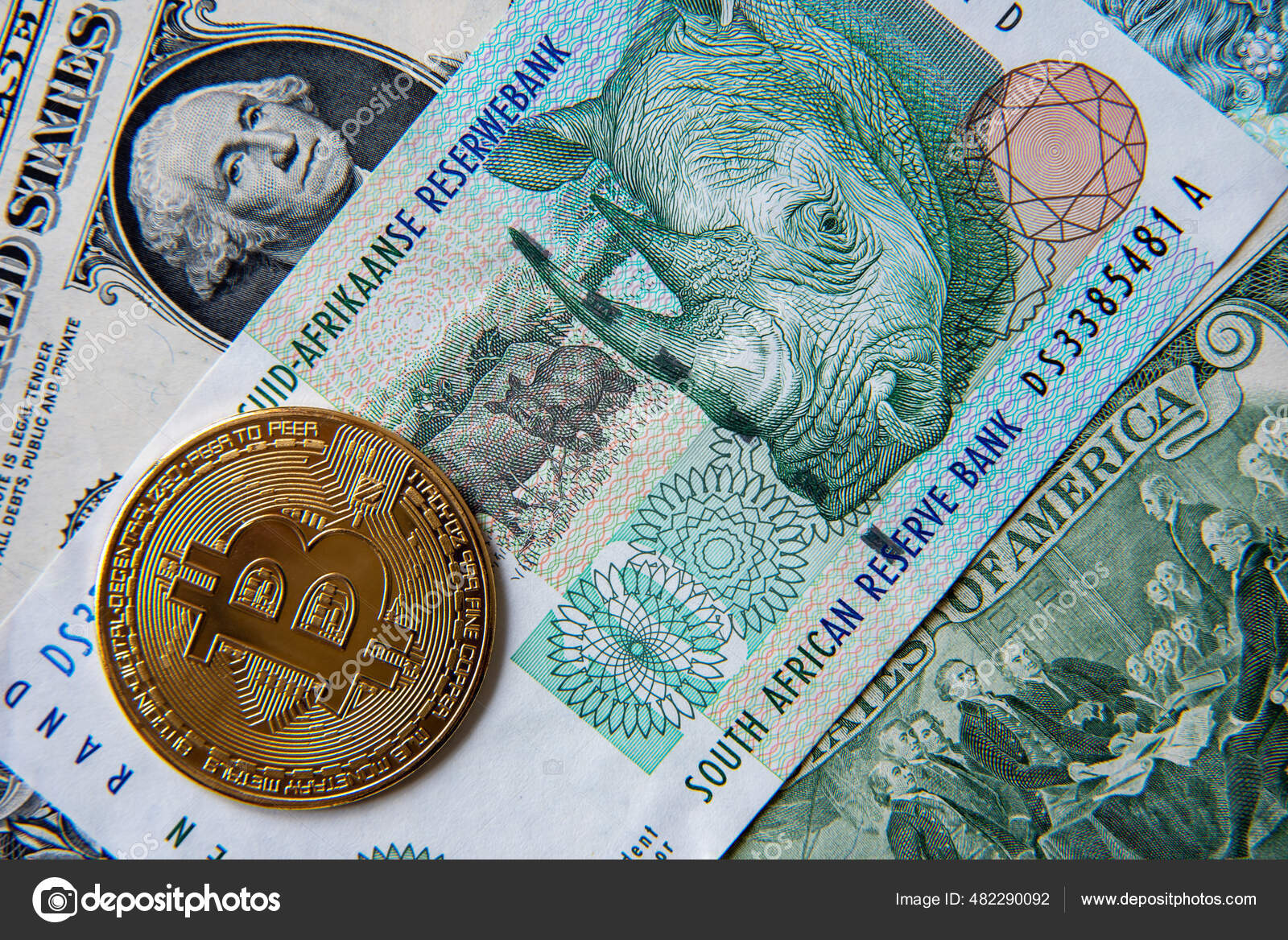 比特币对南非兰特和美元特写形象数字加密货币相对于世界传统货币的概念形象—— 库存社论照片© Stan_pit #482290092
