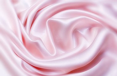 Doku, arka plan, desen. Elbise dikmek için açık pembe ipek kumaş. Atlas.