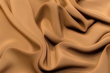 İpek kumaş krep de Chine kahverengi sanatsal düzen. Doku, arka plan. şablon.