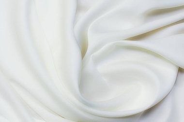 Beyaz kumaş arka planının soyut ve yumuşak odak dalgası, beyaz doku ve detay