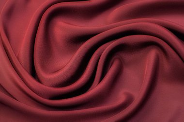 Doğal kırmızı ya da turuncu kumaş ya da kumaşın yakın çekim dokusu aynı renkte. Doğal pamuk, ipek, yün veya keten kumaş dokusu. Kırmızı ve turuncu tuval arkaplan.