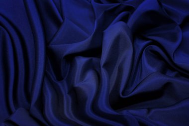 Sentetik kumaşın dokusu koyu mavi. Arkaplan, desen.