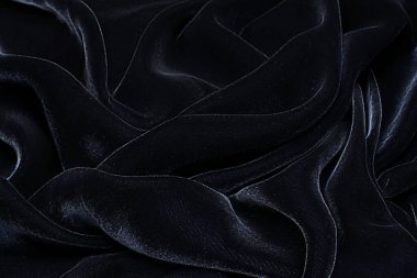 Yapışkan kadifeden ipek kumaş. Siyah renk. Doku, arkaplan, desen.
