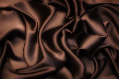 Pürüzsüz kahverengi ipek ya da saten doku soyut arkaplan olarak kullanılabilir. Lüks arka plan tasarımı. Sepia tonunda. Retro biçimi