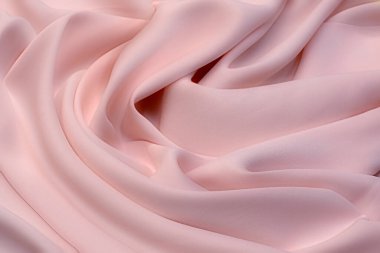 Kumaş sıvısı (ipek). Renk açık pembe. Doku, arkaplan, desen.